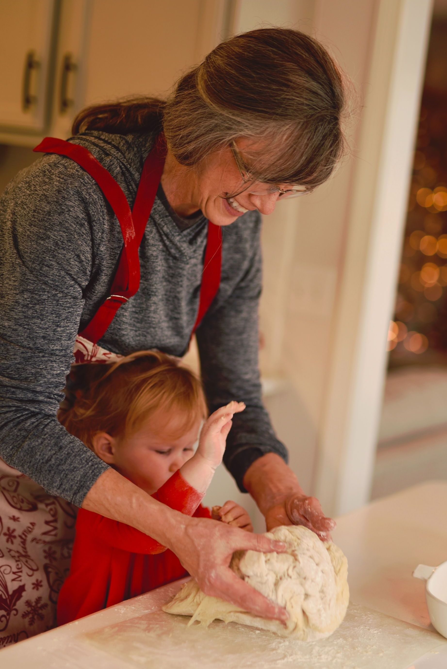 older lady baking with toddler