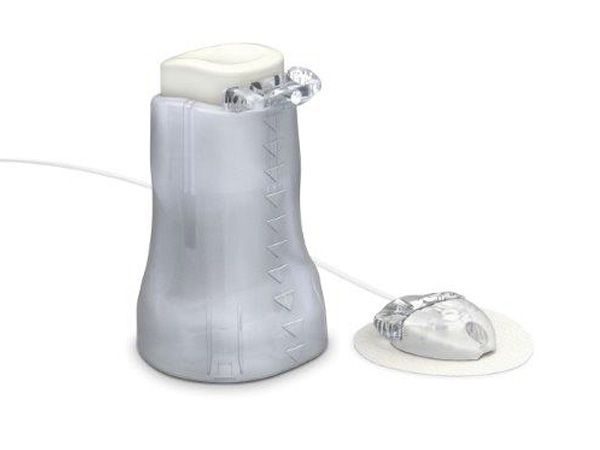 A bottle with a small device attached to it