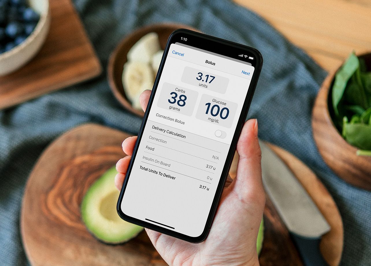 A person is holding a cell phone in their hand.