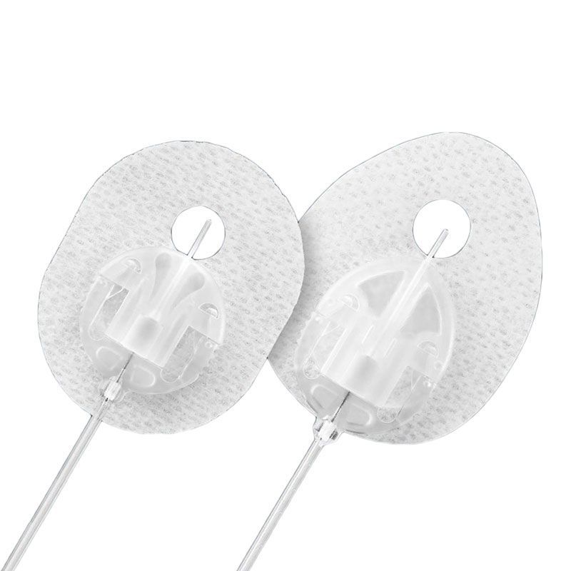 A pair of needle protectors with a hole in the middle on a white background.