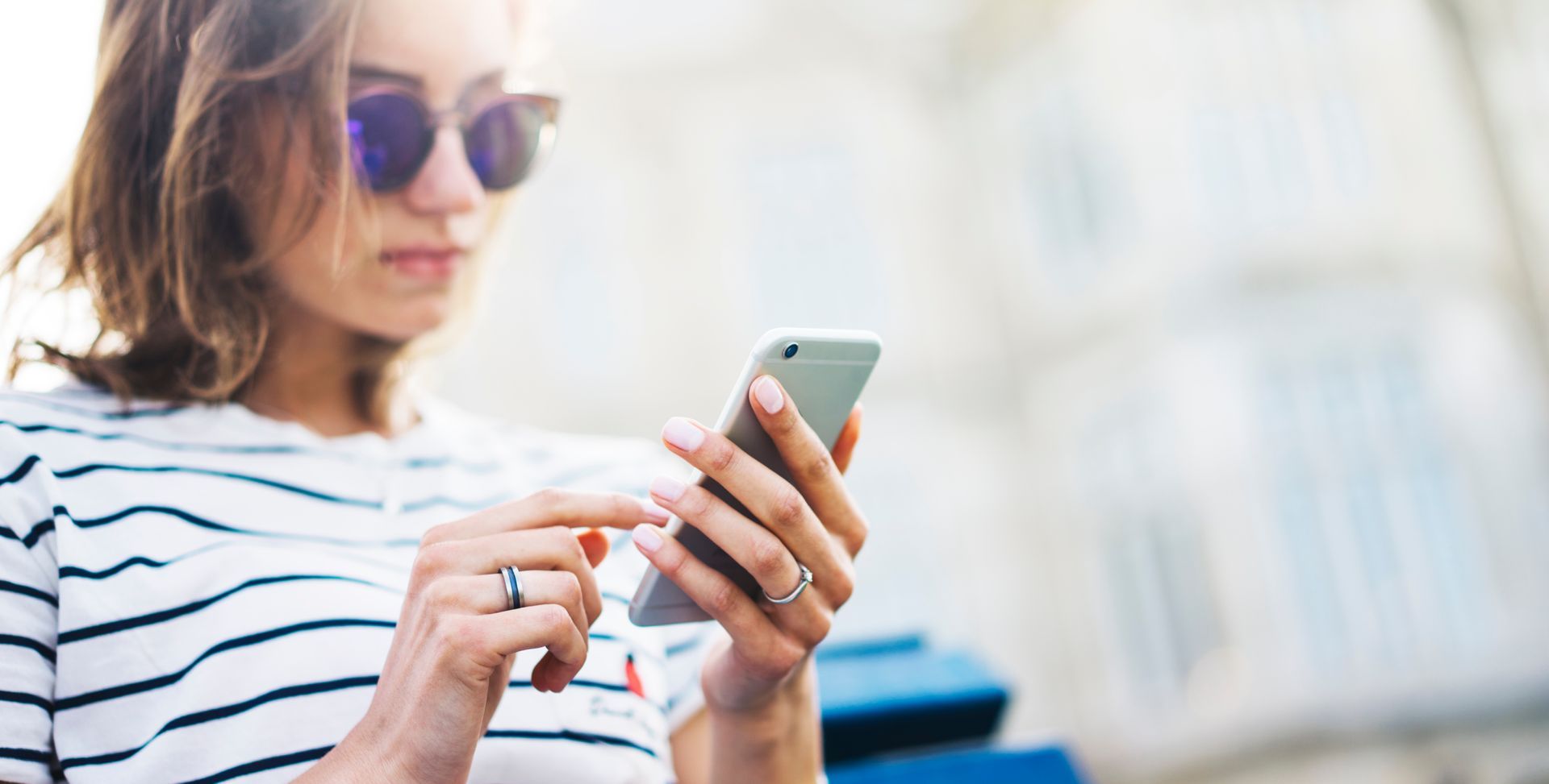 A large pink building with lots of windows and a large porch