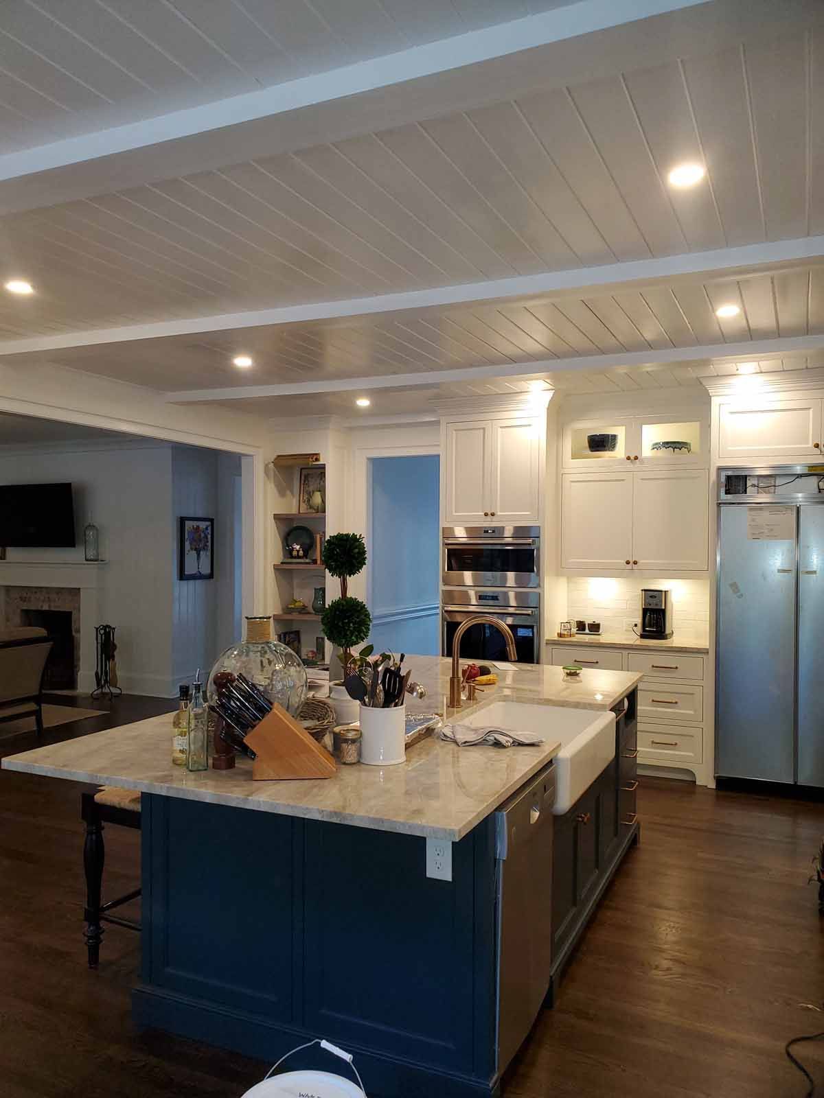 A kitchen with a large island in the middle of it.