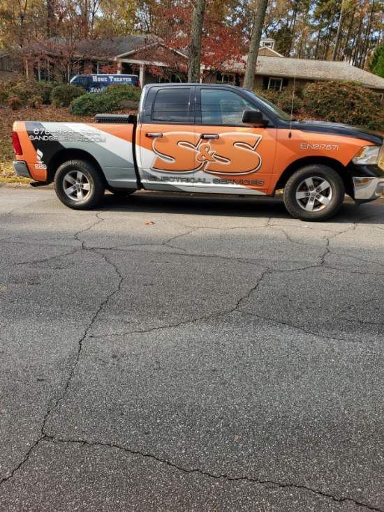 A ram truck is parked on the side of the road