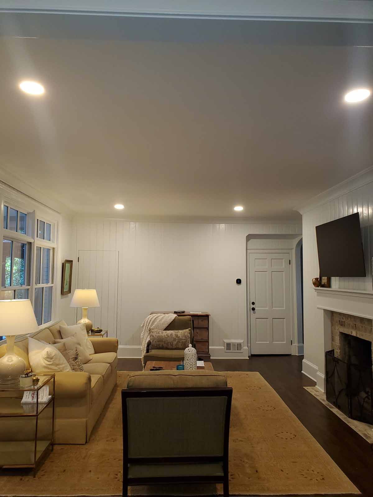 A living room filled with furniture and a fireplace.