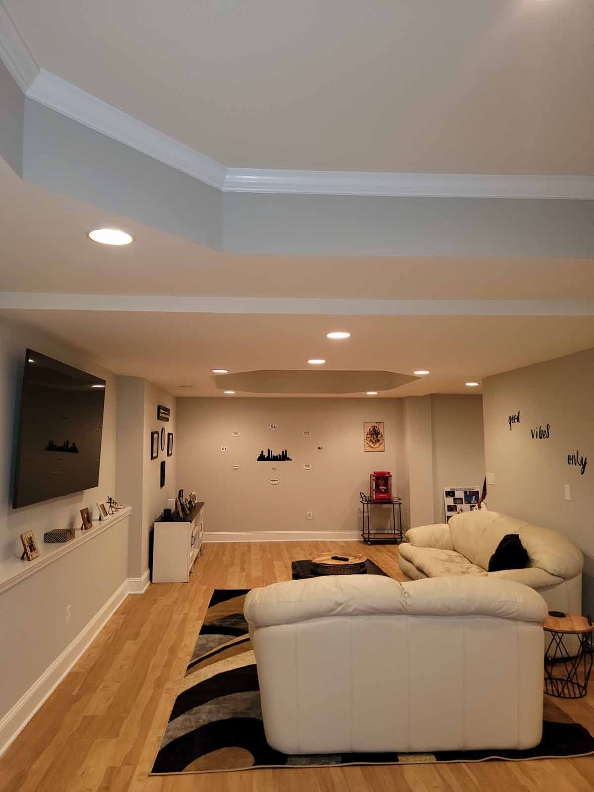 A living room with a couch and a flat screen tv