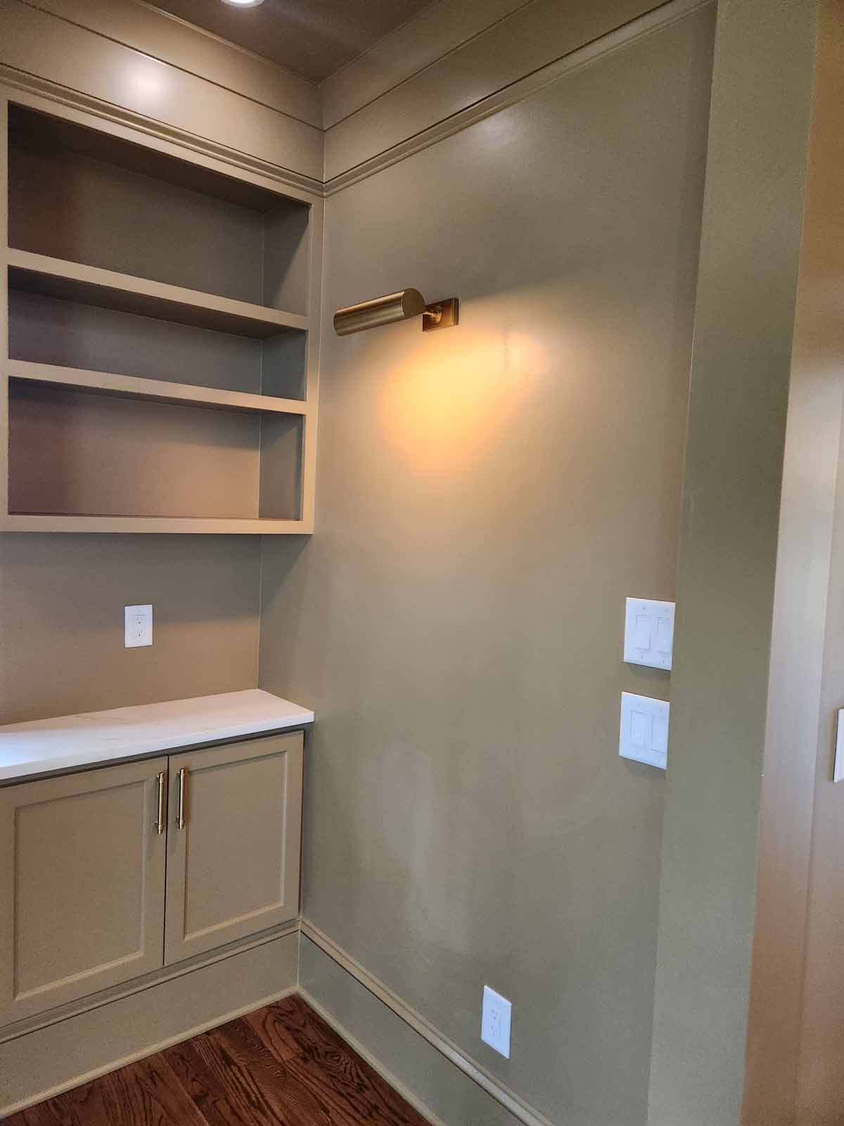 There is a light on the wall in the corner of the room.