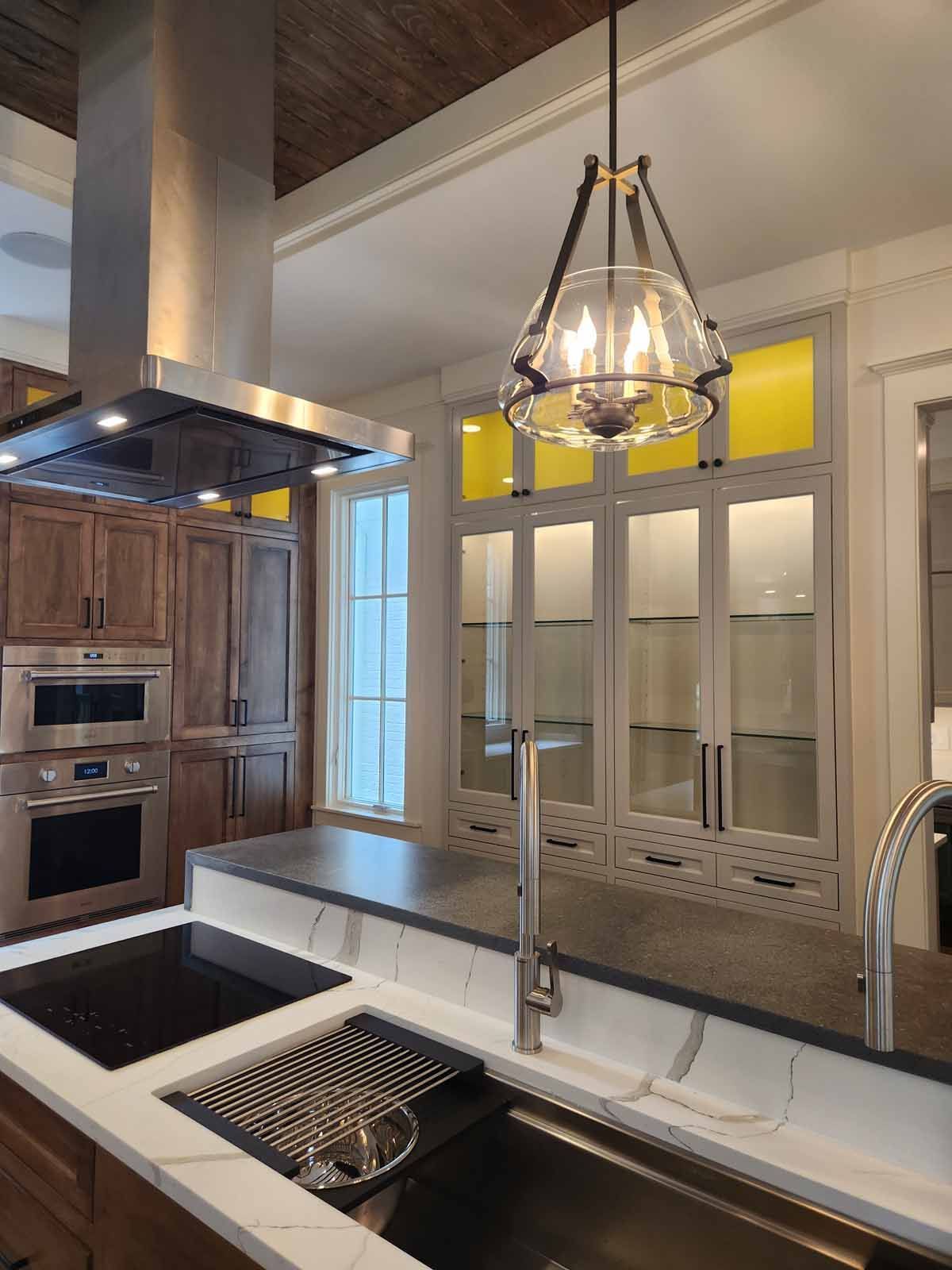 A kitchen with stainless steel appliances and a sink.