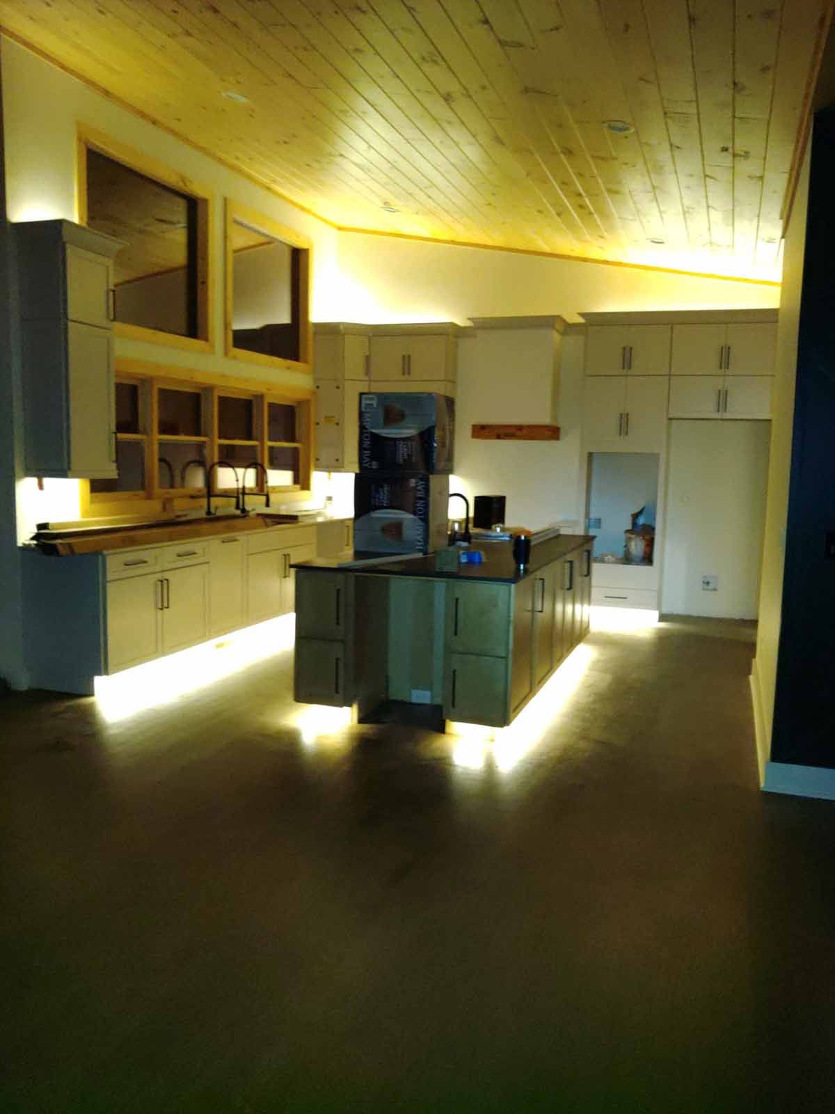 A kitchen with a large island and lots of cabinets