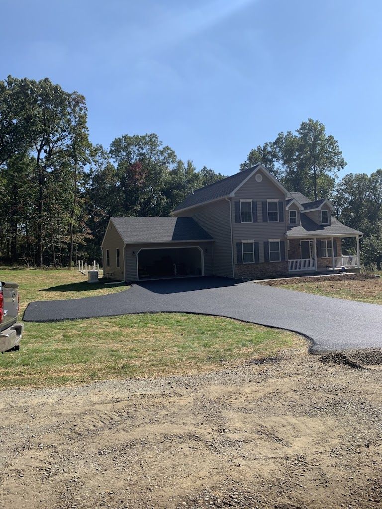 A Large House with a Driveway and a Truck — Kutztown, PA — B Young Paving