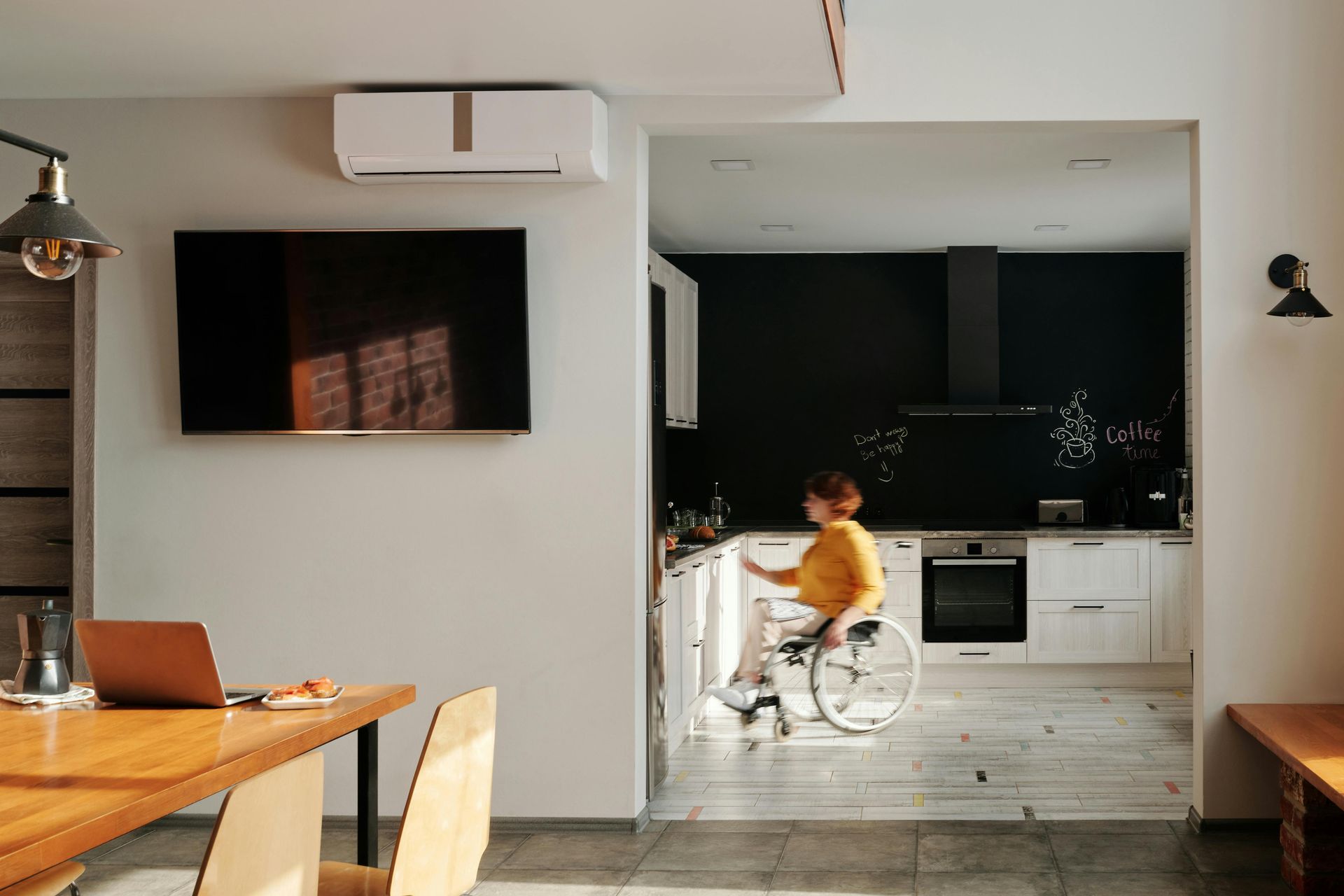 Woman rolling her wheelchair in the kitchen