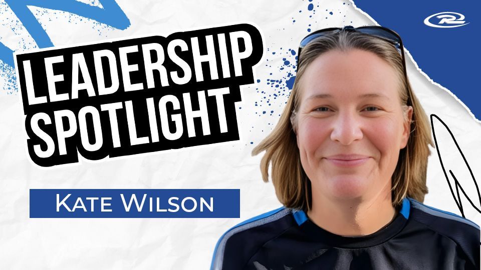 Leadership Spotlight graphic featuring a smiling Kate Wilson against a white, blue, and torn-paper background.