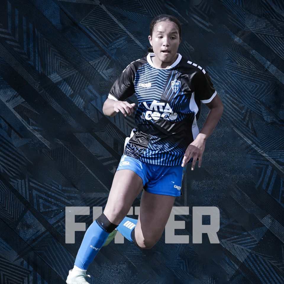 A soccer player in a blue and black uniform runs against a dark, patterned background with large text behind them.