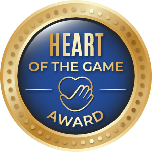 Heart of the Game Award badge: gold border, blue center with text, heart/hand icon,