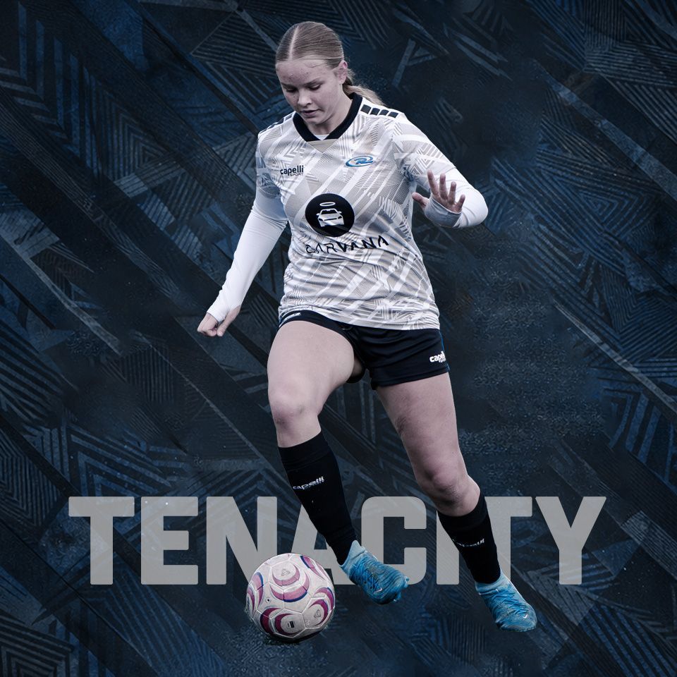 A soccer player in a white and blue uniform dribbles a soccer ball against a patterned dark background with text.