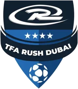 TFA Rush Dubai logo: blue shield with white text, stars, soccer ball, and stylized 