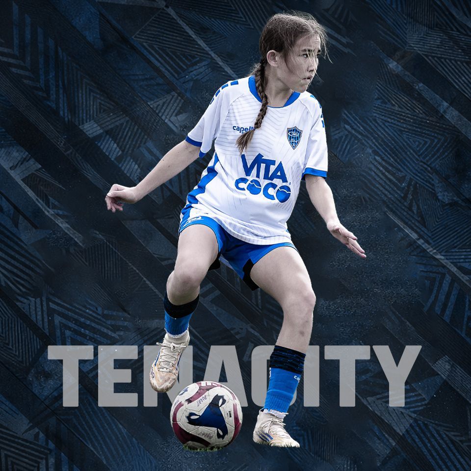 A soccer player in a white and blue uniform dribbles a soccer ball against a textured dark background with the text TENACITY.