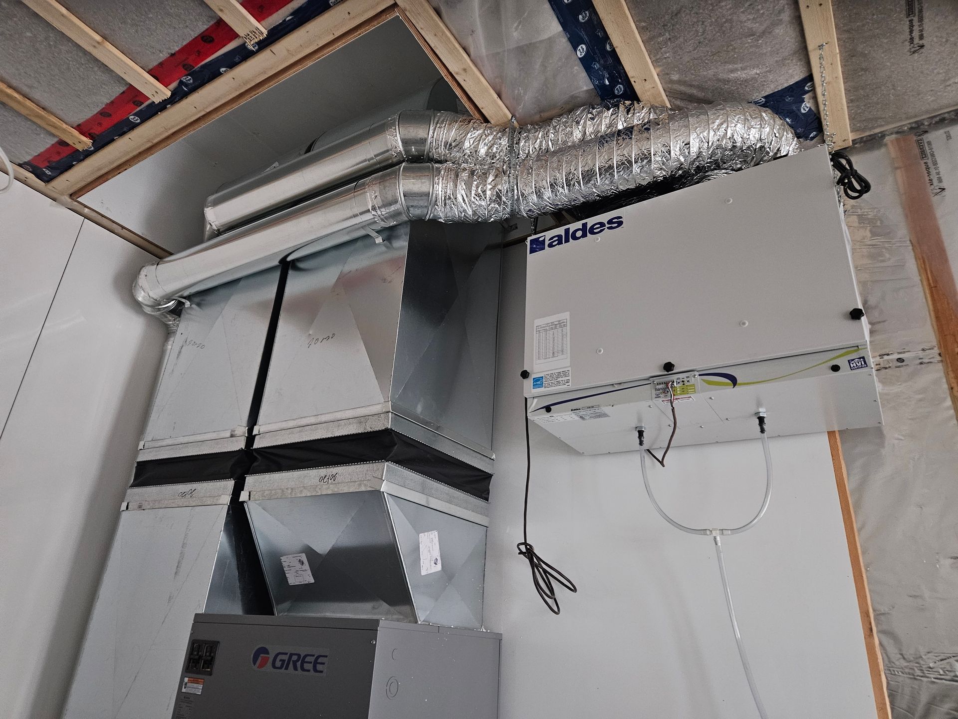 A ventilation system is being installed in a room.