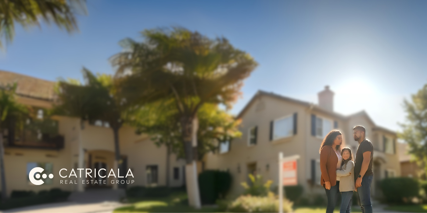 Family in front of a house with a