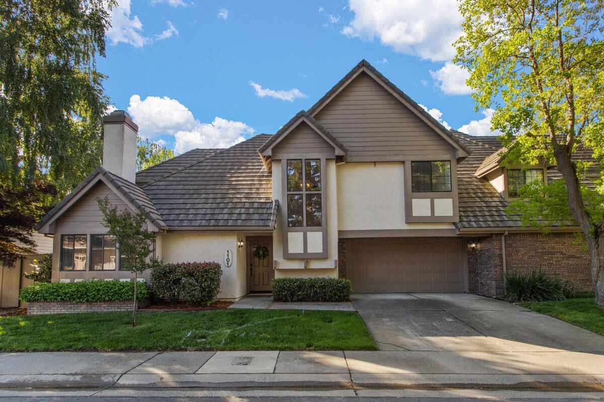 A large house with a garage and a lot of windows | Homes for Sale in Greenvhaven-Pocket, Sacramento, CA