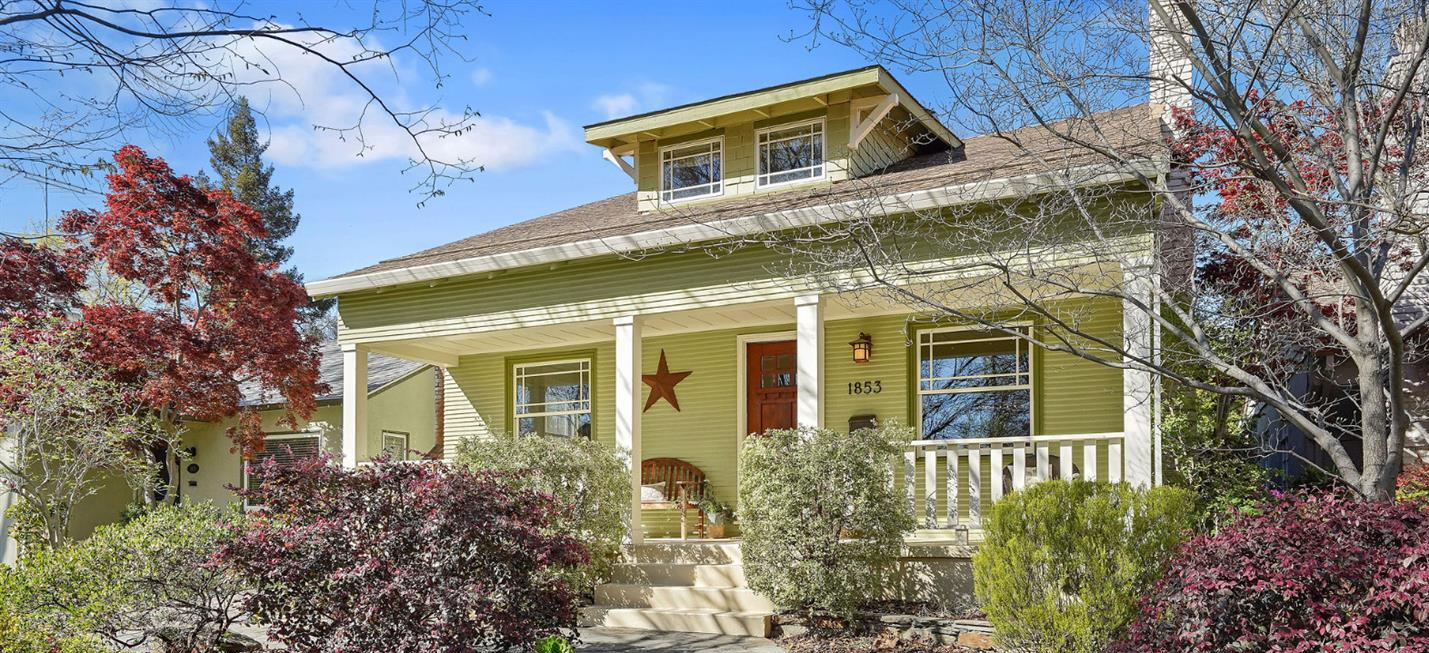 Yellow house with a porch and a red door | Discover homes for sale in Greenhaven-Pocket, CA with Renee Catricala