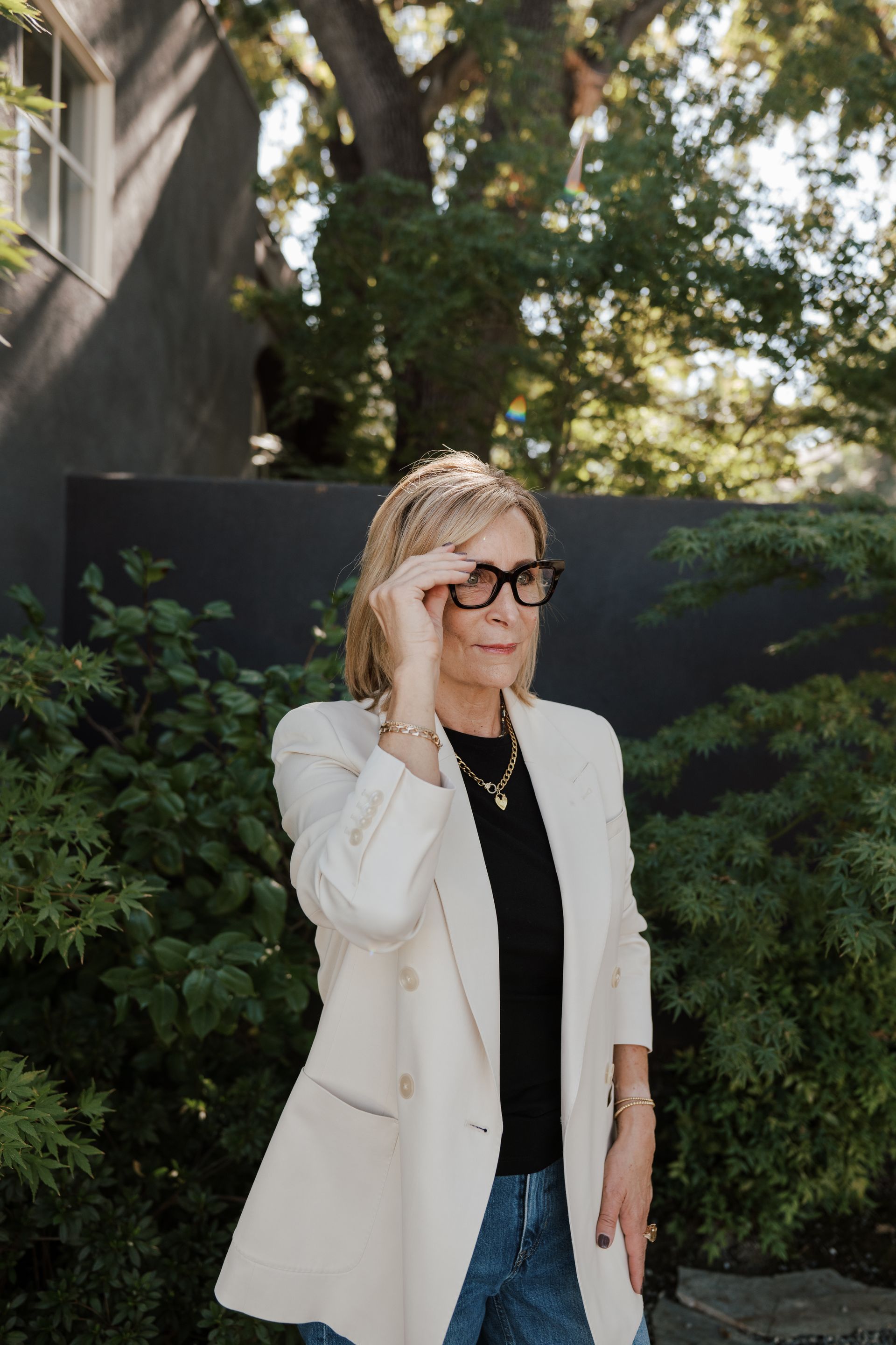 Renee’ Catricala wearing glasses and a white jacket is standing | Realtor in Greenhaven-Pocket, Sacramento, CA