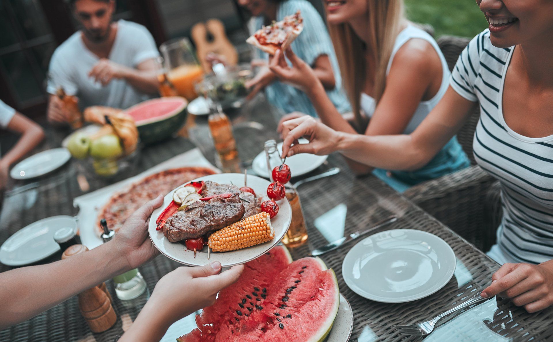 A group of people seated at a table, enjoying a meal