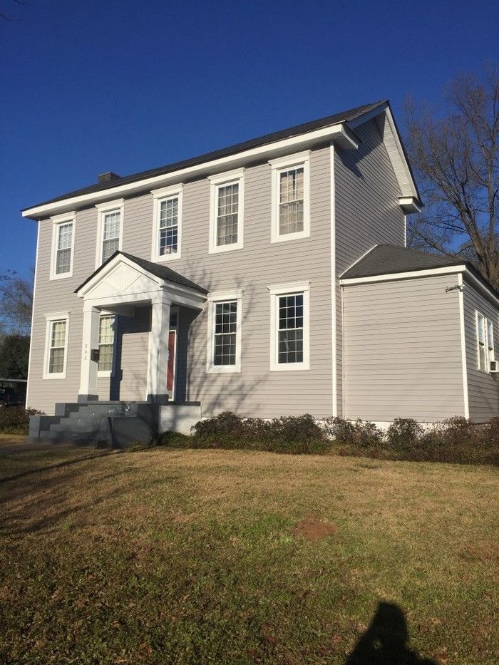 Side view of a house with a lot windows