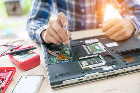 Computer Repair — Computer Technician Repairing Laptop Computer in Saint Paul, MN