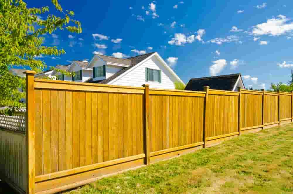 Wooden Fence in a Backyard, House in the Background — A&H Fences In Aylmerton, NSW