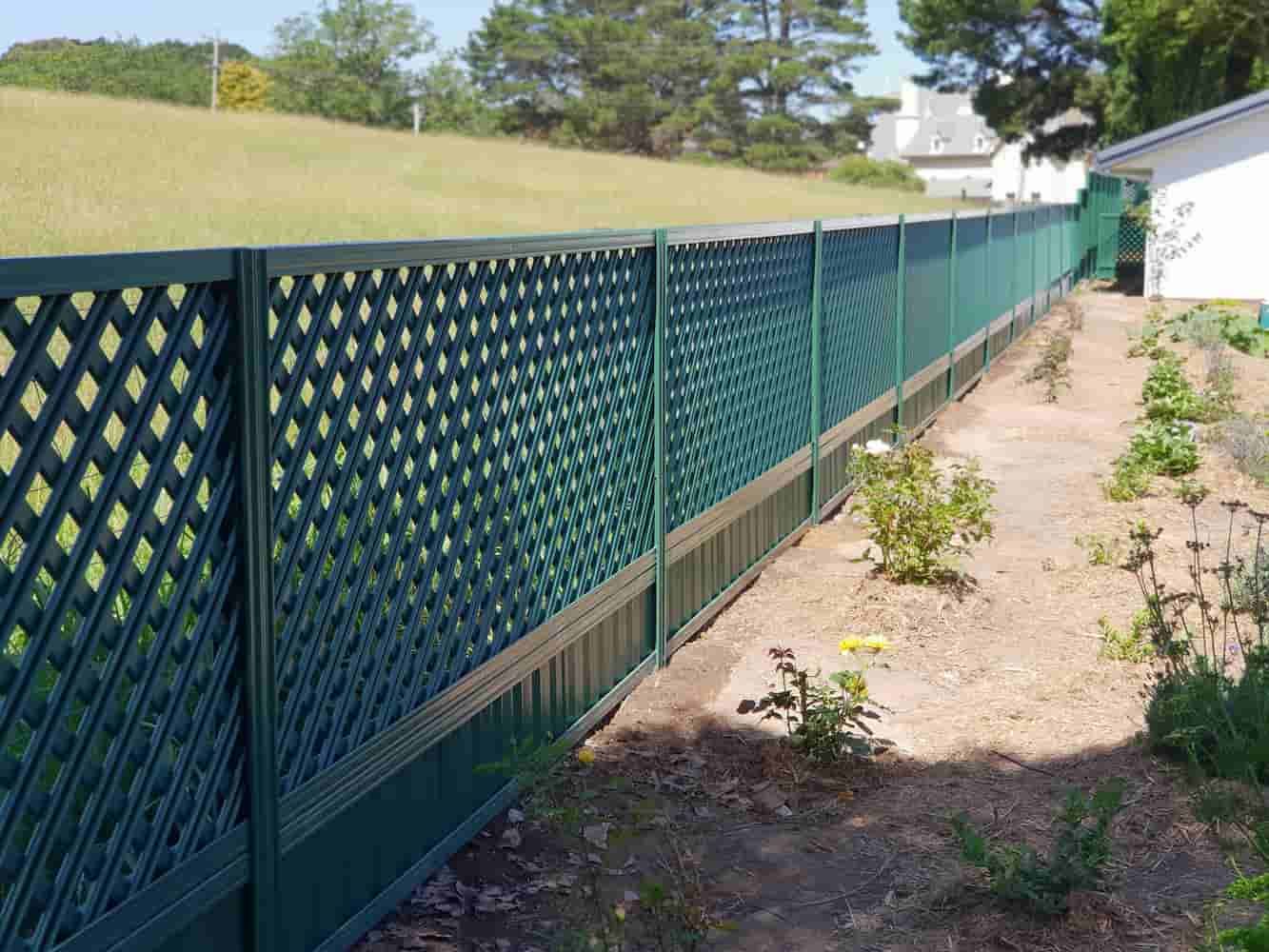 Green Lattice Fence Along a Garden Bed — A&H Fences In Bowral, NSW