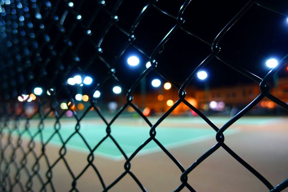 Nighttime Shot of a Chain-link Fence — A&H Fences In Aylmerton, NSW