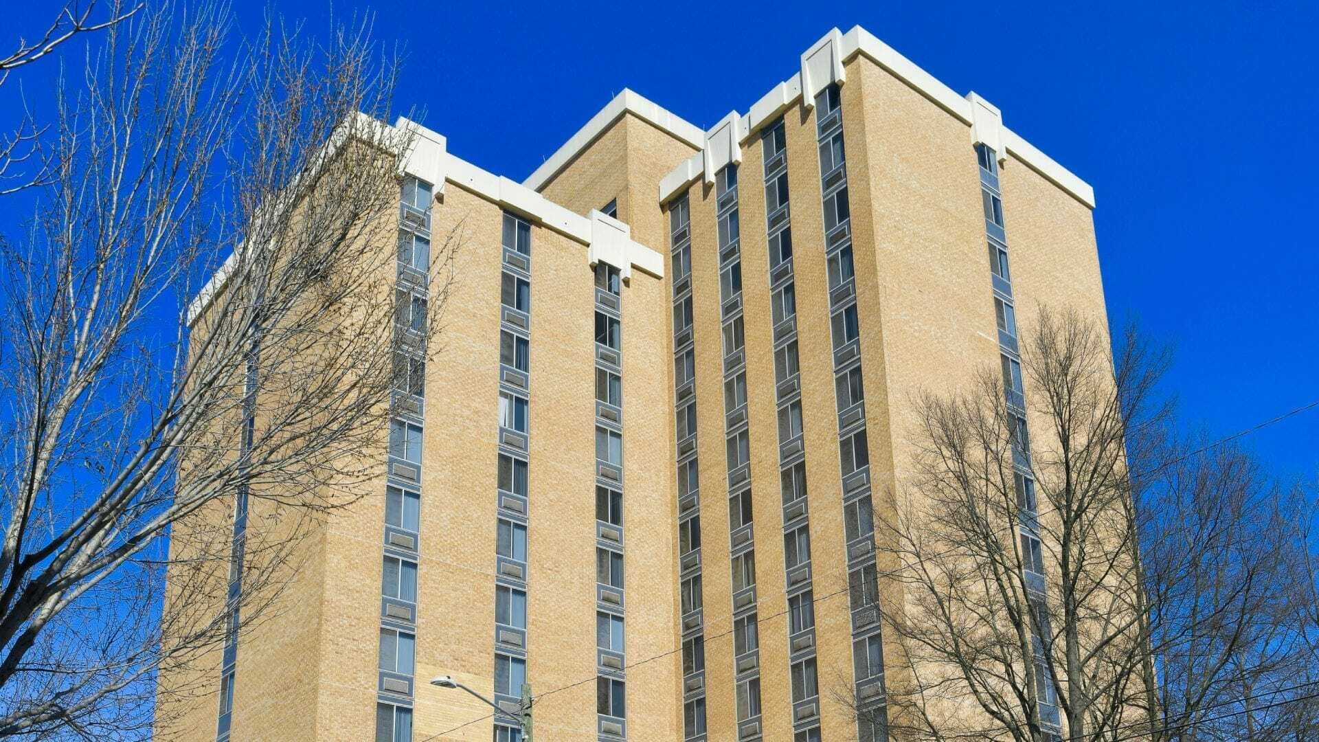 A Tall Building With A Blue Sky In The Background — Atlanta, GA — Lutheran Towers