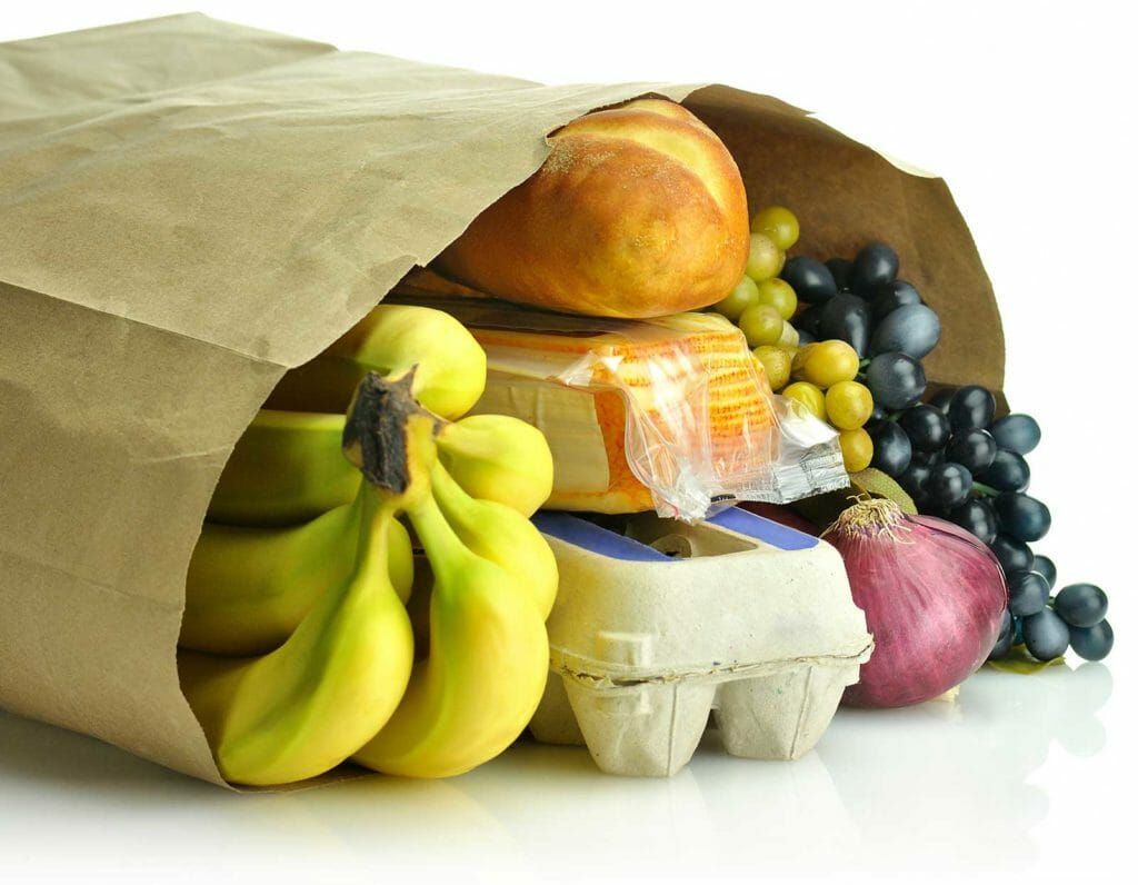 A Brown Paper Bag Filled With Bananas Eggs Bread And Grapes — Atlanta, GA — Lutheran Towers