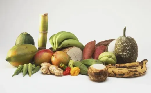 A bunch of fruits and vegetables on a white surface