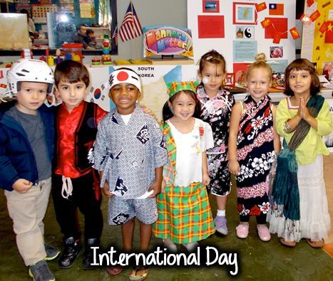 A group of children dressed in costumes for international day