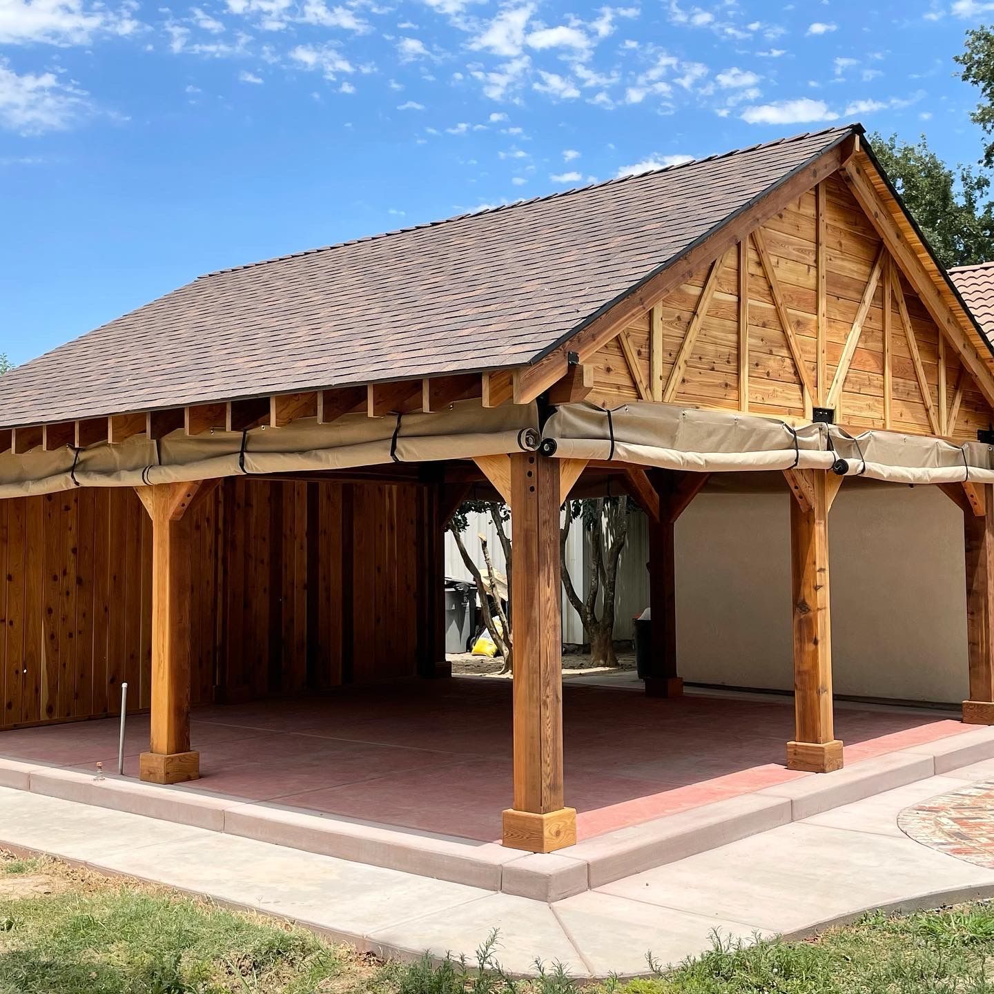 A wooden structure with a roof and a canopy