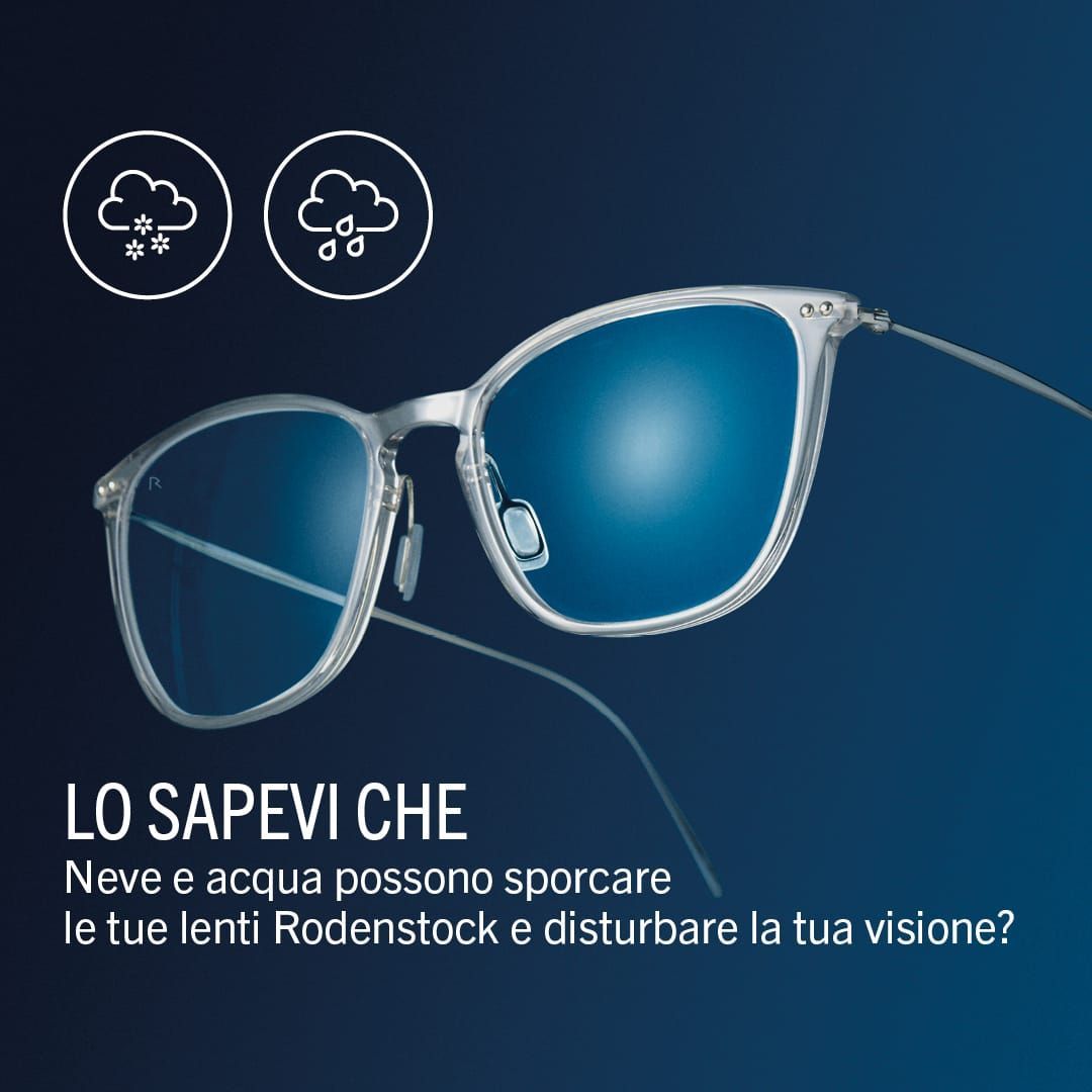 Occhiali da sole con montatura quadrata nera e lenti blu sfumate, su una superficie bianca, con una scatola con il marchio 