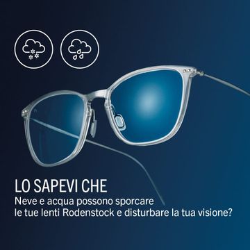 Occhiali da sole con montatura quadrata nera e lenti blu sfumate, su una superficie bianca, con una scatola con il marchio