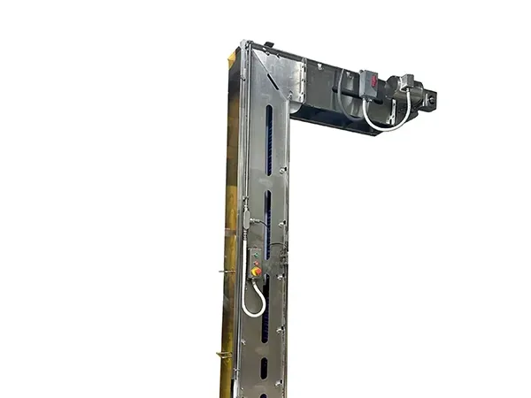 Control panel with green, red, and yellow buttons, likely for industrial equipment, mounted on metal tubing.