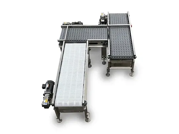 Three connected conveyor belts in a manufacturing setting, stainless steel frame.