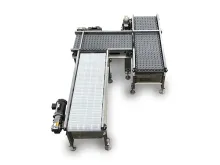 Three connected conveyor belts in a manufacturing setting, stainless steel frame.