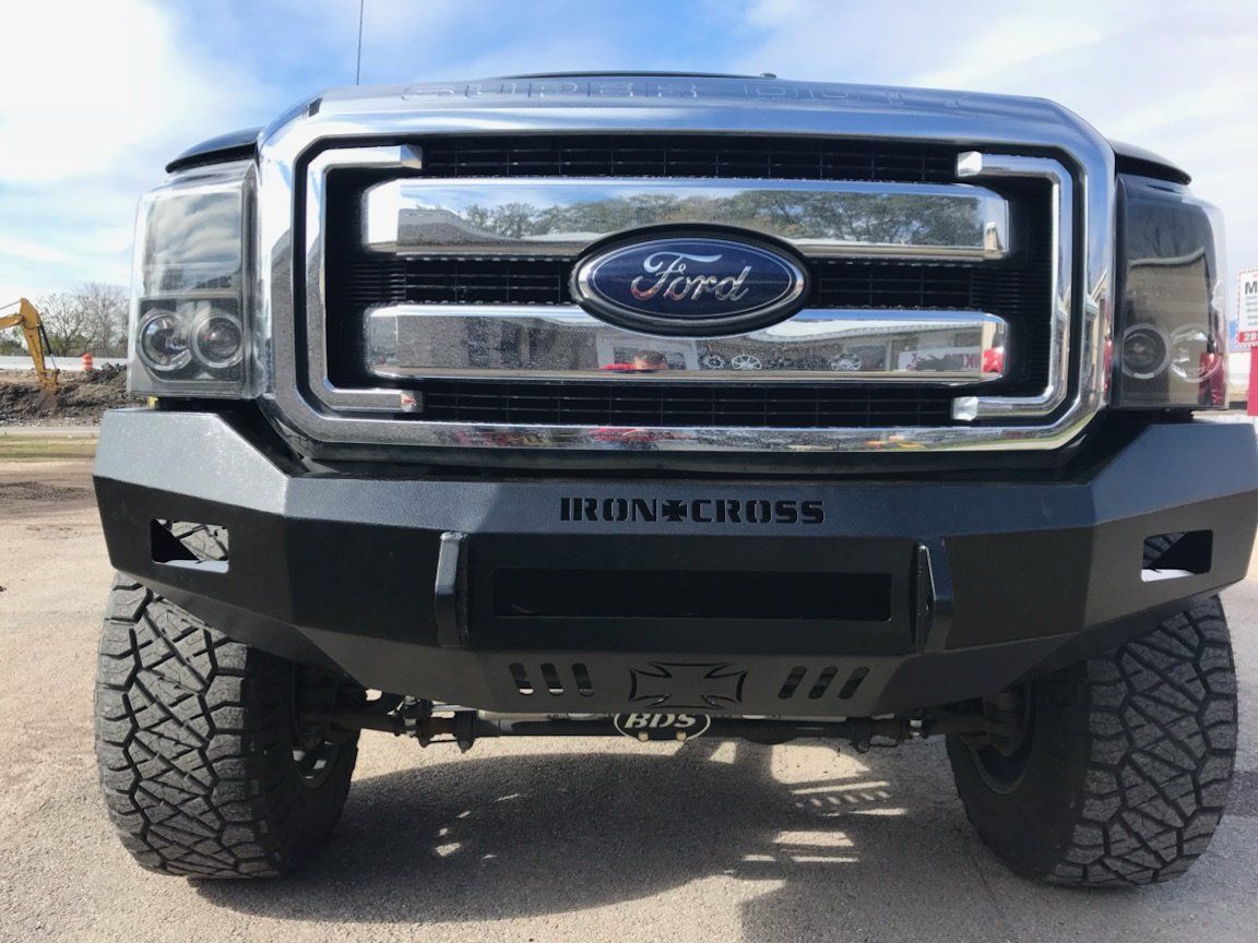 A ford truck with a bumper that says bron cross on it
