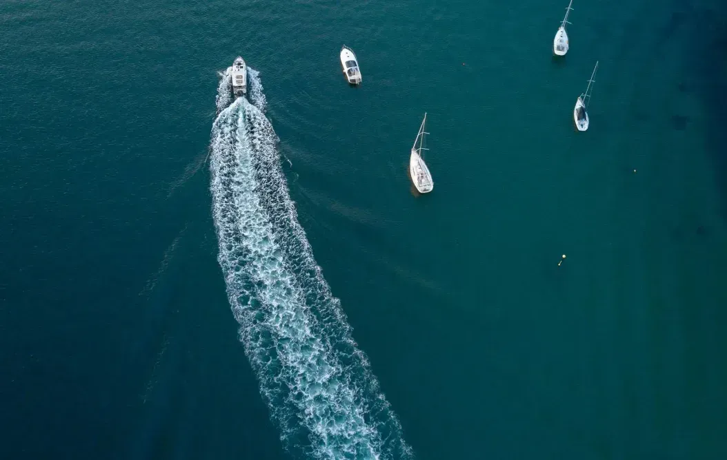 An aerial view of boats in a large body of water