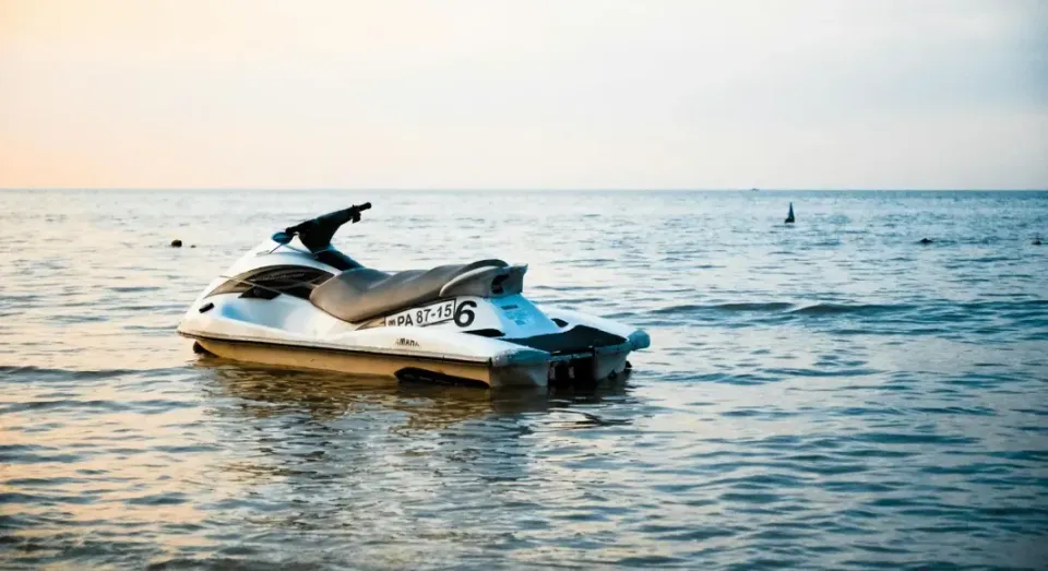 A jet ski is floating on top of a body of water.