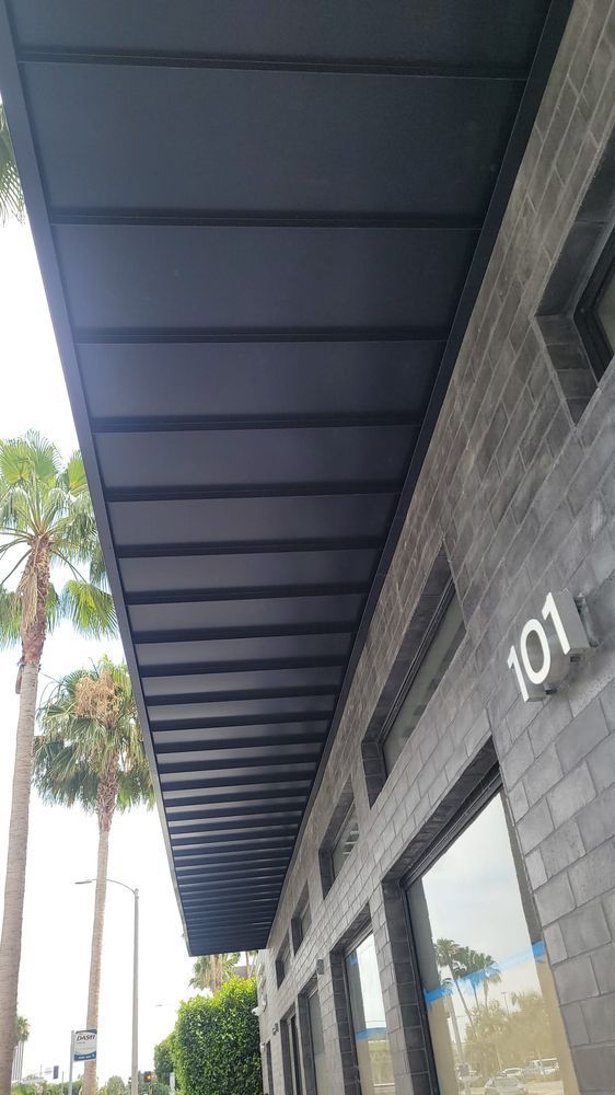 The roof of a building with a canopy over it.