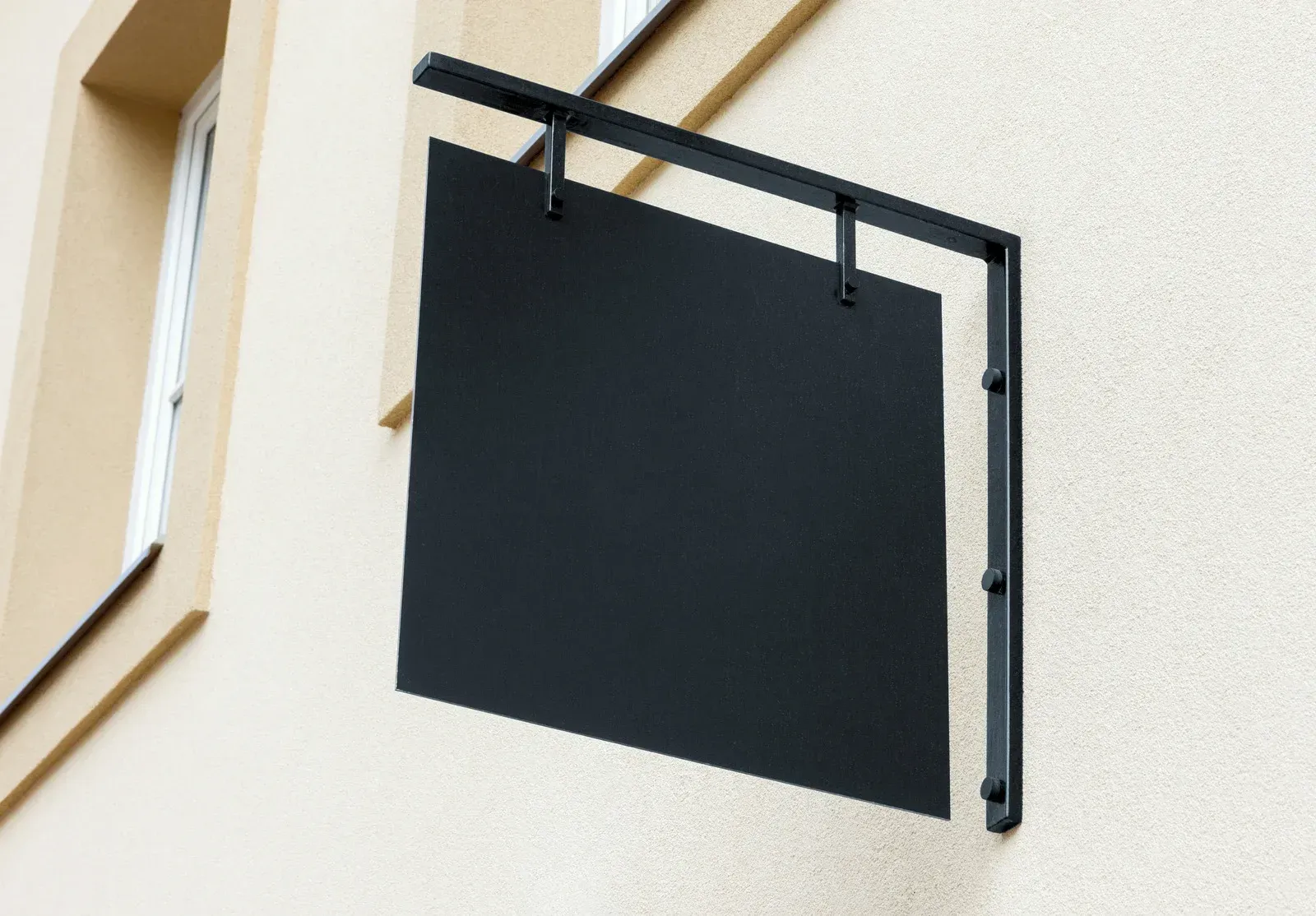 A building with a black awning over the front door