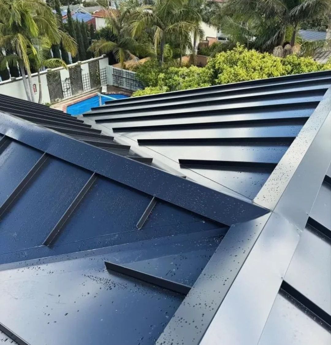A close up of a roof with a pool in the background