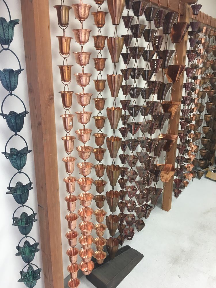 A display of copper rain chains in a store