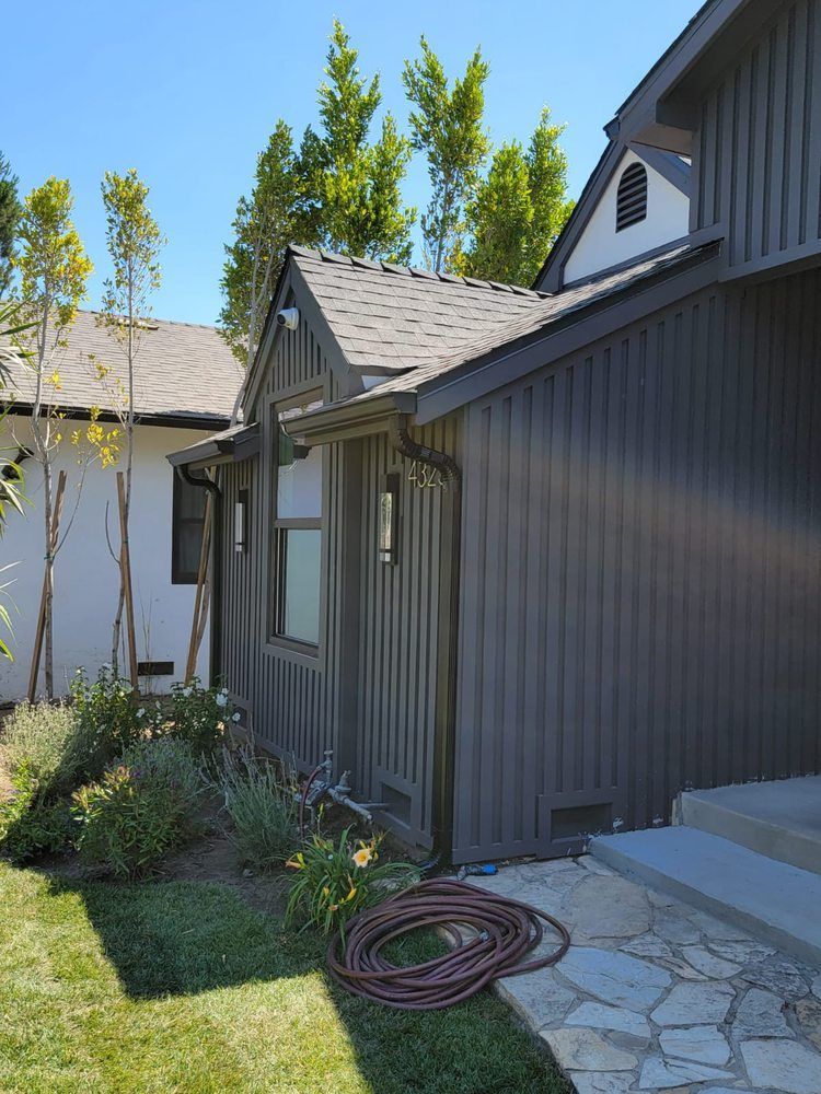 A house with a hose in front of it