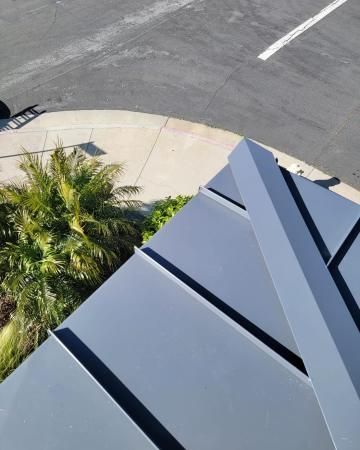 A house with a wooden door and a large window